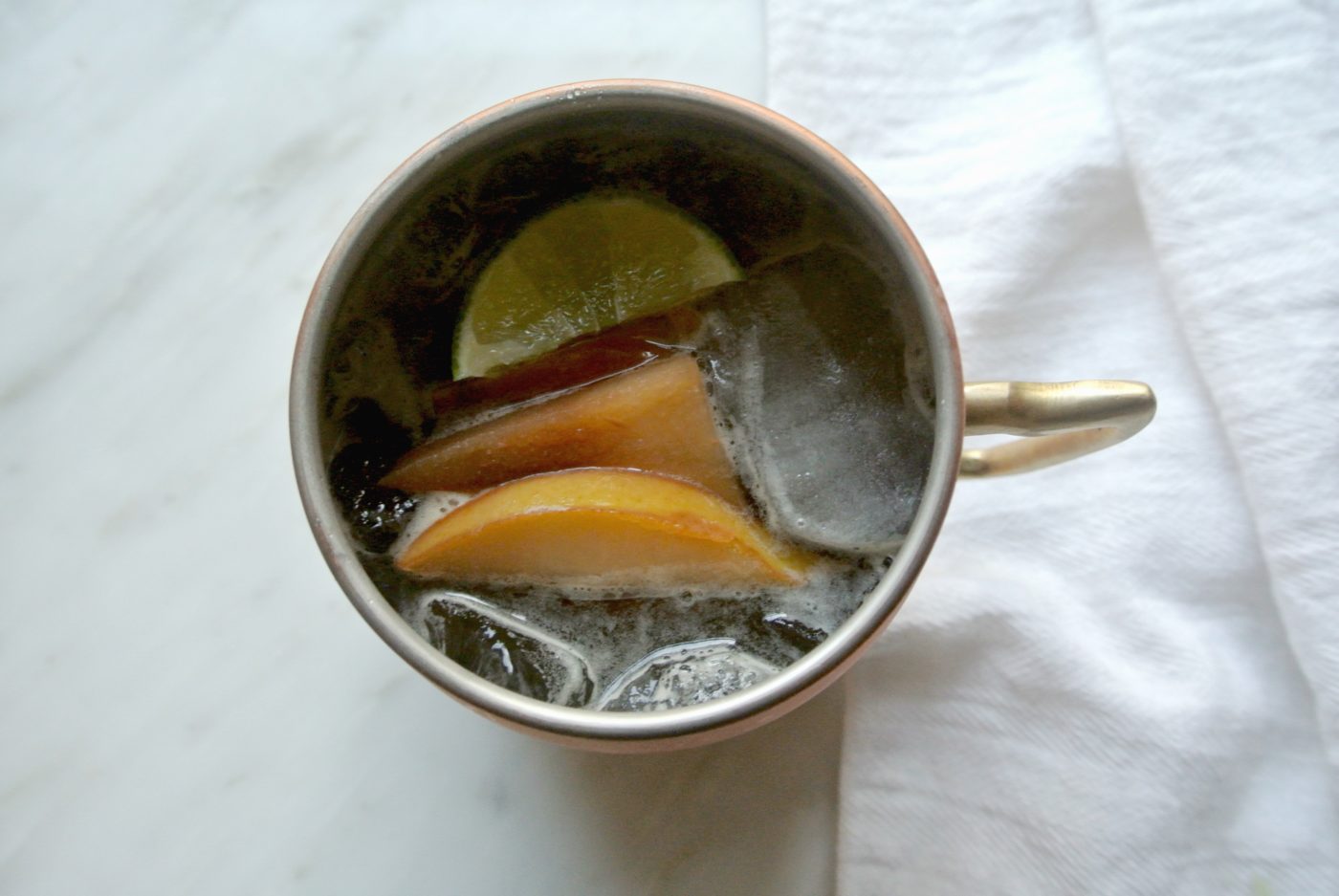 Garnishing your pear Moscow mules with pears from the vodka infusion makes the drink pretty but it's also really tasty.