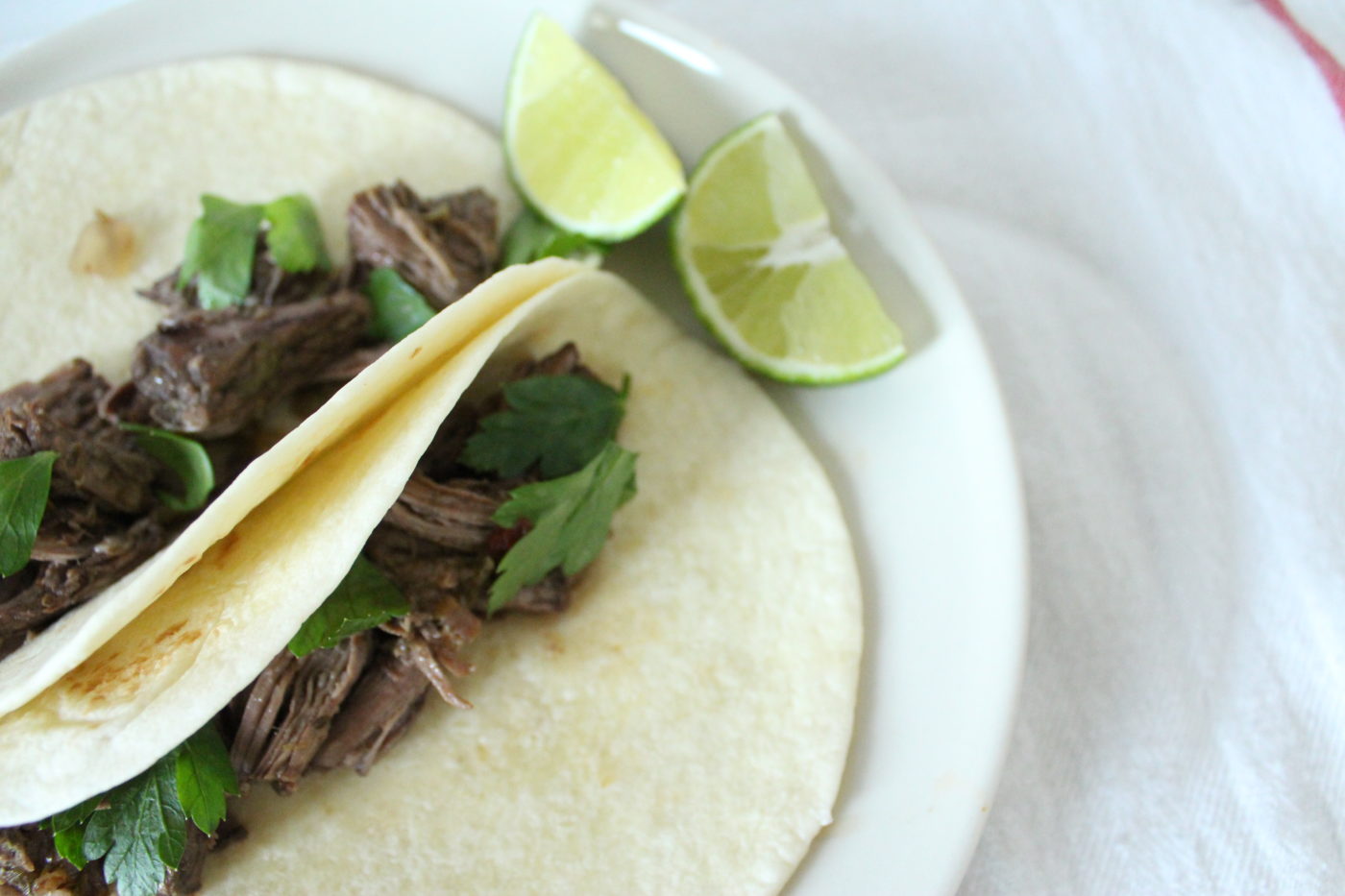 Slow cooker barbacoa is great for burritos, tacos or nachos. If you're like me, you'll have to stop yourself from just eating it out of the bowl.