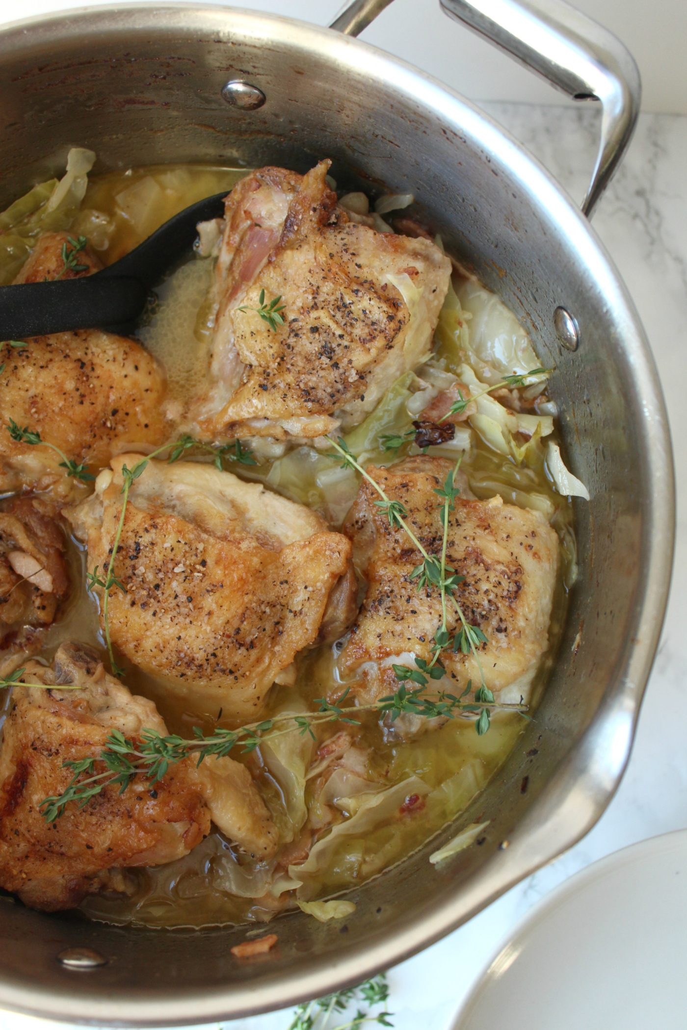 Braised chicken thighs and cabbage.