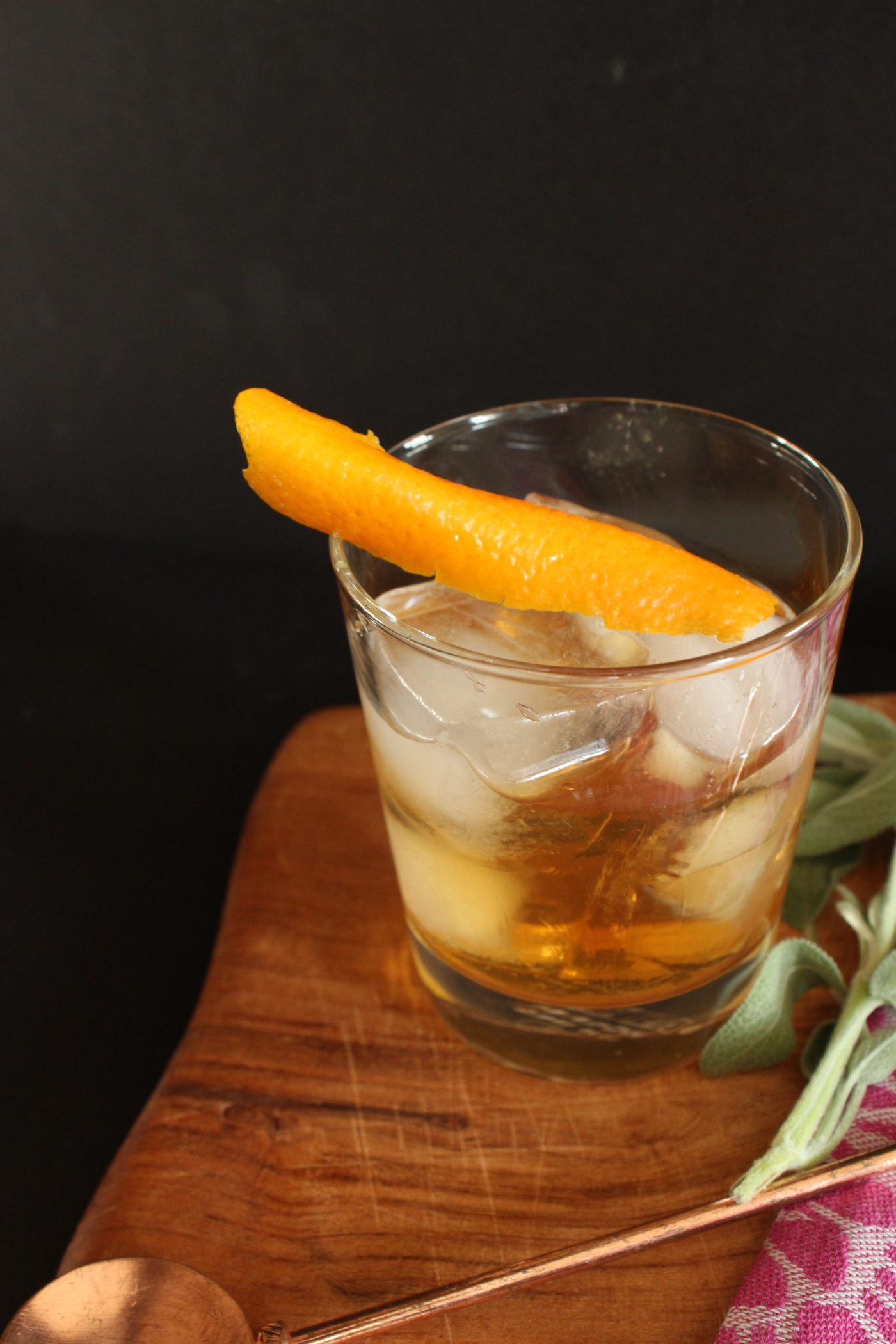 Rocks glass with ice and bourbon.