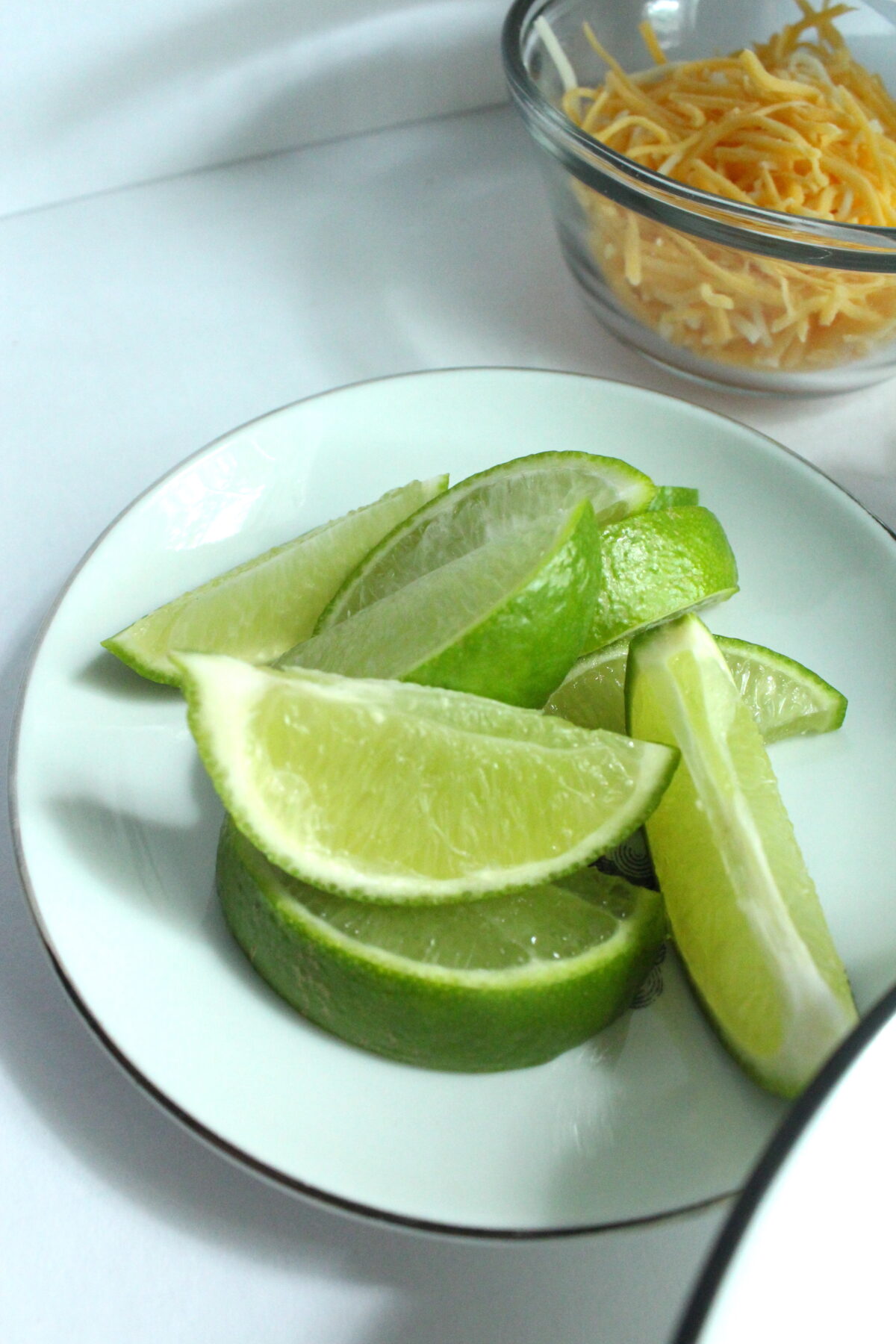 A plate of sliced limes.