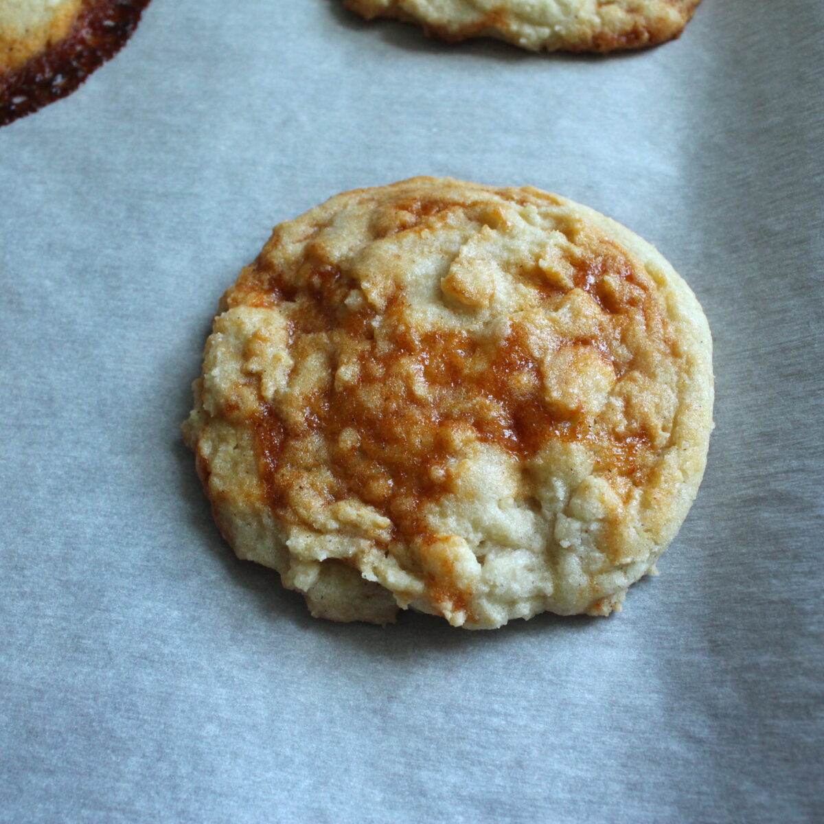 Baked gochujang caramel cookie on a baking sheet.